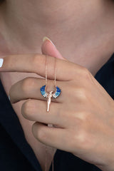 Taki | Hugging Couple Silver Necklace with Blue Stone Michael Angel Wings - TryAladdin